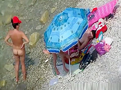Nude women in rocky beach