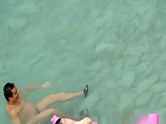 Nude women in rocky beach