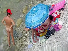 Nude women in rocky beach