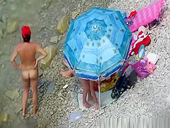 Nude women in rocky beach