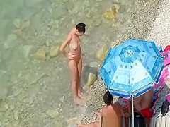 Nude women in rocky beach