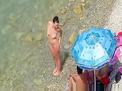 Nude women in rocky beach