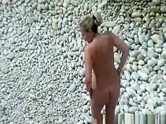 Couple in the beach sunbathing