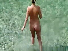 Couple in the beach sunbathing