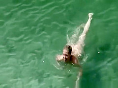 Couple in the beach sunbathing