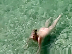 Couple in the beach sunbathing