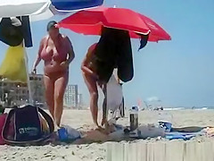 Woman with big breasts on the beach