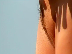 Sideways view of a nicely trimmed pussy