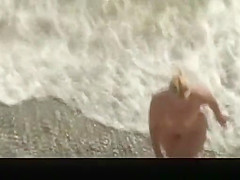 Two nude women refreshing their bodies