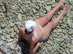 Naked girl with stones on her nipples