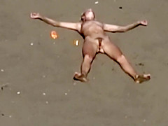 Dirty nudist girl on the beach