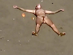 Dirty nudist girl on the beach