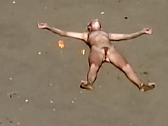 Dirty nudist girl on the beach