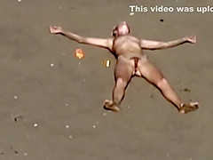 Dirty nudist girl on the beach