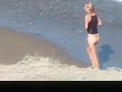 Blonde woman wearing just black top