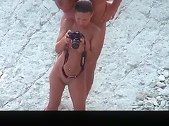 Nude woman with pierced belly and tattoo