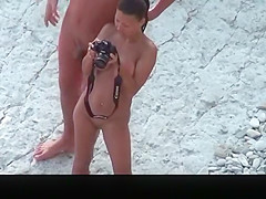 Nude woman with pierced belly and tattoo