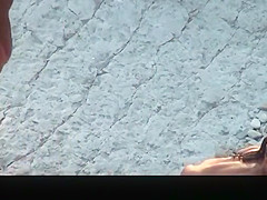 Nude woman with pierced belly and tattoo