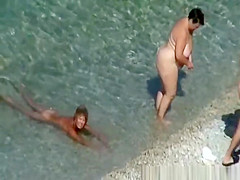 Mature nudist women in the water