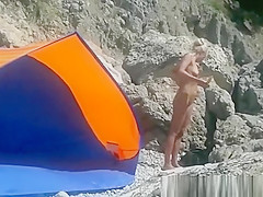Blonde nudist woman secretly filmed at beach