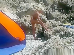 Blonde nudist woman secretly filmed at beach