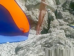 Blonde nudist woman secretly filmed at beach