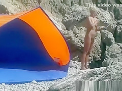 Blonde nudist woman secretly filmed at beach