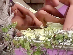 Spying a black mistress fucked by a pool