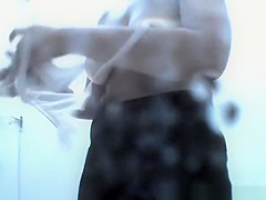 Woman enters beach cabin to undress her clothes