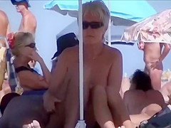 Horny mature nudists at a beach
