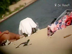 Nudist woman laid down sunbathing