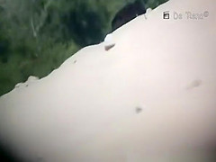 Nudist woman laid down sunbathing