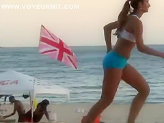 Girls playing volleyball in a tight bikini