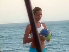 Girls playing volleyball in a tight bikini