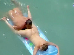 He eats her ass and pussy in the water