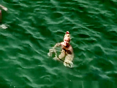 Nudist woman refresh in the water