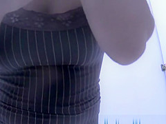 Girl changing in beach cabin.