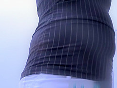 Girl changing in beach cabin.