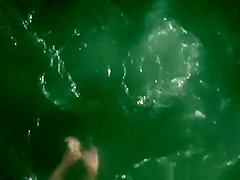 Nudist couple enjoying the fresh water