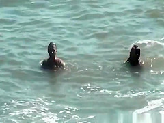 Nudist women in the water