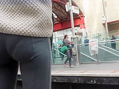 Curly haired nudist on the beach