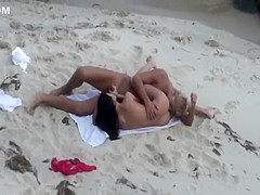 Beach sex gets filmed from the bushes