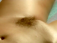 Spying a mature woman as she tans
