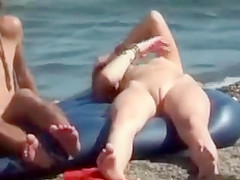 Nude hippie girl on an air mattress