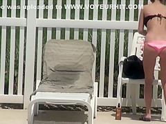 Voyeur spies a girl by the swimming pool