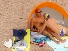 Milf strips down to enter the water