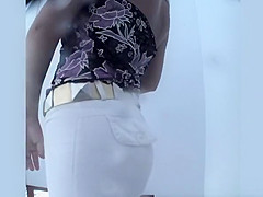 Woman spied in beach cabin dressing