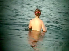 Hippie girl caught bathing in sea