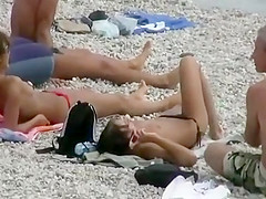 Topless hunt at a beach