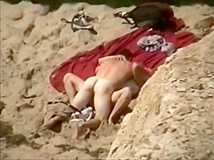 Voyeur spies sex from the cliffs